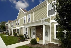 Urbana apartment for rent - a row of houses with a sidewalk in front of them
