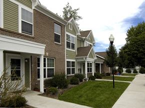Urbana apartment for rent - a row of houses with a sidewalk in front of them