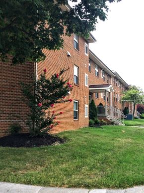 Martinsburg apartment for rent - a large brick building with a tree in front of it