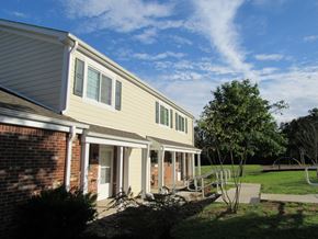 Bidwell apartment for rent - a view of the side of a house with a porch and a tree