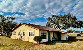 Haines City apartment for rent - A small house with a green door and a brown roof.