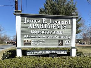 Salisbury apartment for rent - A sign for James E. Leonard Apartments with a phone number and TDD number.
