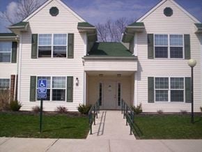 Jamestown apartment for rent - a white house with a sidewalk in front of it