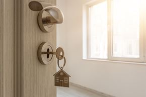 Smithfield apartment for rent - a door knob with a house shaped keychain on the door