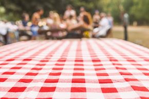 Blanchester apartment for rent - a group of people sitting on a table with a red and white checked table cloth