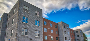 Parkersburg apartment for rent - A large building with many windows is shown in the image.