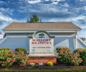 Dunkirk apartment for rent - the mallory meadows sign on the front of a building