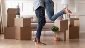 Beardstown apartment for rent - a woman with cardboard boxes in a living room