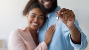 Olney apartment for rent - a man and woman holding a key to a house
