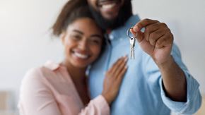 Colchester apartment for rent - a man and woman holding a key to a house