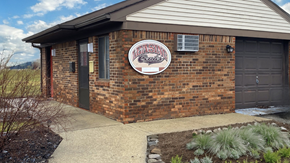 Moweaqua apartment for rent - a brick building with a sign on the front of it