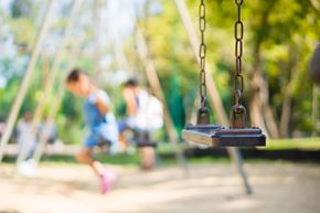 Mount Hope apartment for rent - A swing set with a blurred child in the background.