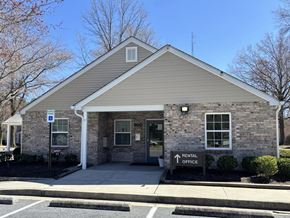 Salisbury apartment for rent - A small building with a sign that says RENTAL OFFICE.