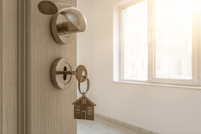 Peebles apartment for rent - a door with a house keychain on the door knob