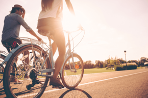 Peebles apartment for rent - a man and a woman riding a bike down a street