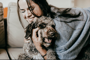 Peebles apartment for rent - a woman sitting on a couch with a dog
