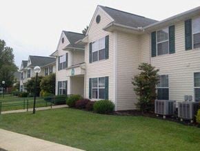 Jamestown apartment for rent - a white house with a lawn in front of it
