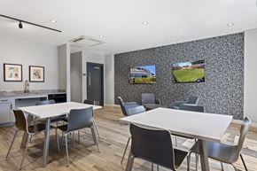 Washington apartment for rent - A modern dining room with a large table and chairs.