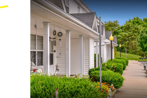 Barnesville apartment for rent - a row of white houses with a sidewalk in front of them