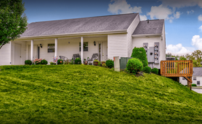 Barnesville apartment for rent - a white house with a porch on a hill