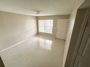 Fellsmere apartment for rent - A room with a tiled floor and a window with blinds.