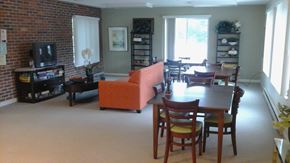 Parsons apartment for rent - A living room with a brick wall and a television.