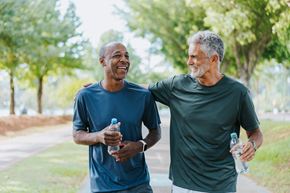 Spring Hill apartment for rent - Two men are walking and talking in a park.