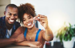 Sebring apartment for rent - A man and woman are smiling and holding up a small object.