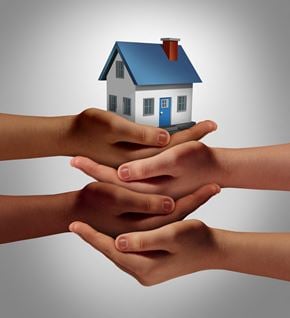 Sistersville apartment for rent - a family holding a house in their hands