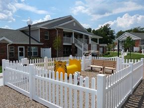 Belpre apartment for rent - a white picket fence in front of a house