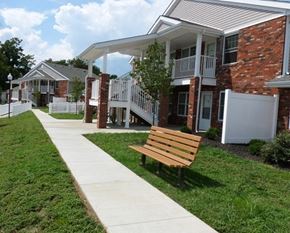 Belpre apartment for rent - a wooden bench in front of a building