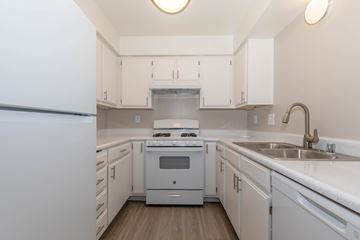 Lancaster apartment for rent - A white kitchen with a stove and sink.