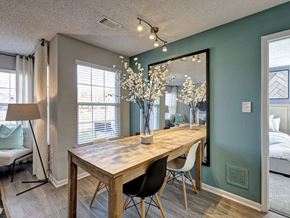 Lawrenceville apartment for rent - A dining room with a wooden table and chairs.
