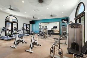 Riverside apartment for rent - A gym with treadmills, exercise bikes, and other equipment.