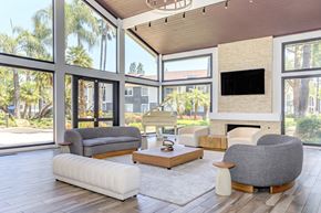 Redlands apartment for rent - A modern living room with a fireplace and a large window.