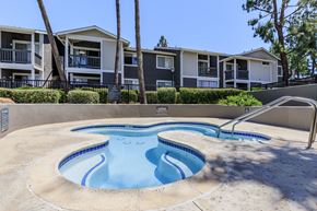 Redlands apartment for rent - A swimming pool in front of apartment buildings.