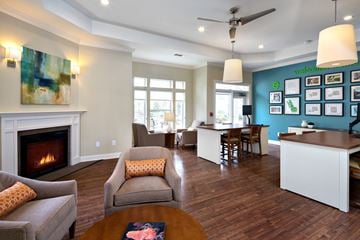 Lawrenceville apartment for rent - A living room with a fireplace and a painting on the wall.