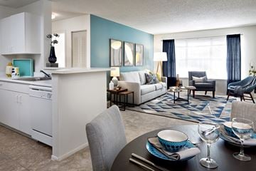Lawrenceville apartment for rent - A modern kitchen with a dining table set for two.