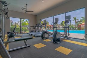Oxnard apartment for rent - A gym with a variety of equipment including treadmills, weights, and exercise machines.