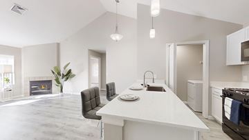 Manchester apartment for rent - A modern kitchen with a dining table and chairs.