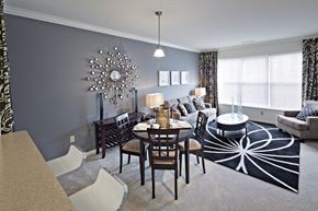 West Long Branch apartment for rent - A dining room with a table set for six and a chandelier hanging from the ceiling.