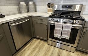 Clovis townhouse for rent - A modern kitchen with a stainless steel oven and dishwasher.