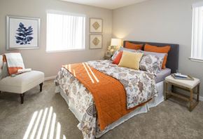 Santa Maria apartment for rent - A bedroom with a large bed and a chair.