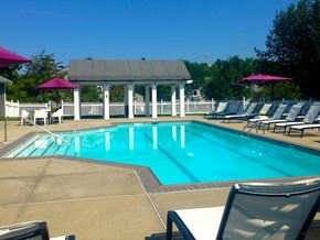 Lawrenceville apartment for rent - A pool with a white fence and a gazebo in the background.