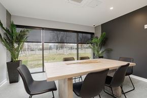Nashville apartment for rent - a dining room with a table and chairs in front of a window