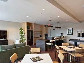South Bend apartment for rent - A modern kitchen with a dining table and chairs.