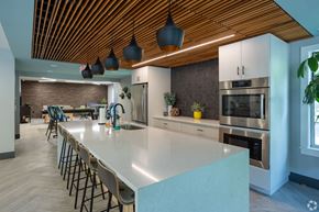 Elkhart apartment for rent - a large kitchen with a large white counter top and a dining room with a table