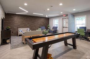 Elkhart apartment for rent - a game room with a foosball table and a couch