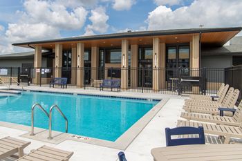 Spacious pool deck with grilling stations
