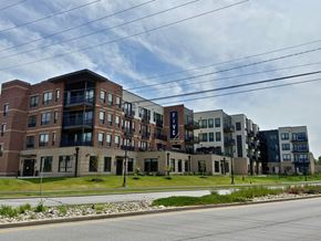 South Bend apartment for rent - A large apartment complex with multiple buildings and balconies.